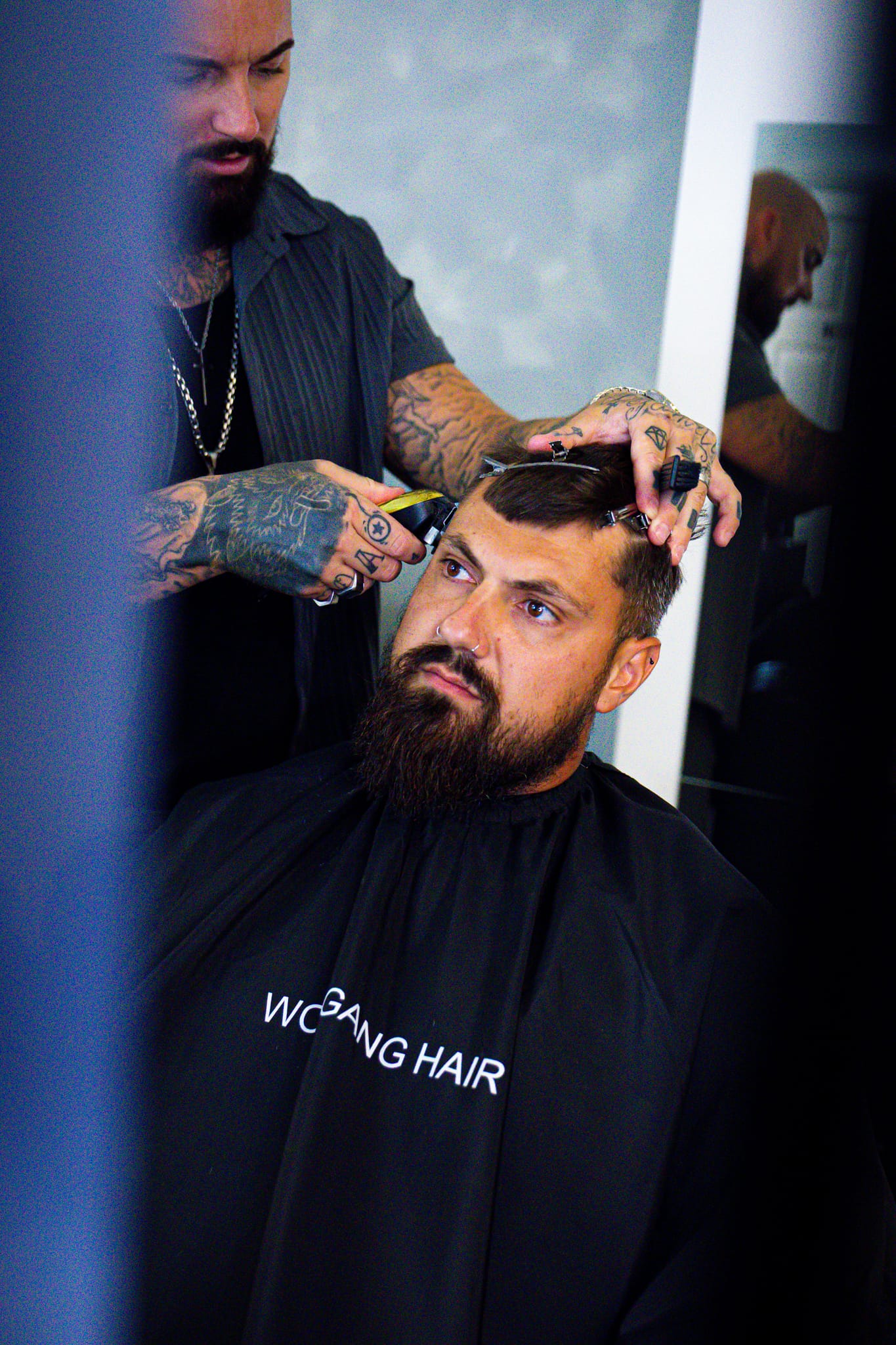 Wolfgang Hair barber finishing a cut